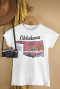 Cruise through the heartland in style with this vibrant pink Caddy, your ticket to an unforgettable Oklahoma adventure.